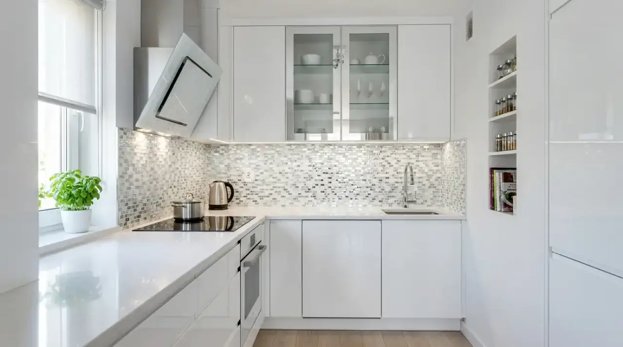 White backsplash dark cabinets. Bright wall finish adding lift and contrast to deeper cabinetry.